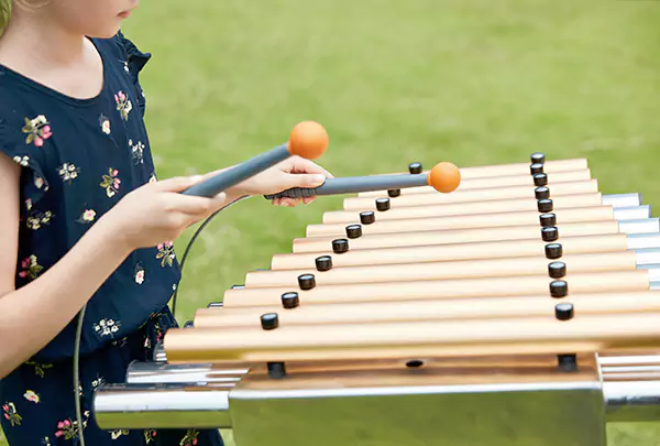 Which outdoor playground equipment is suitable for placement in kindergartens?